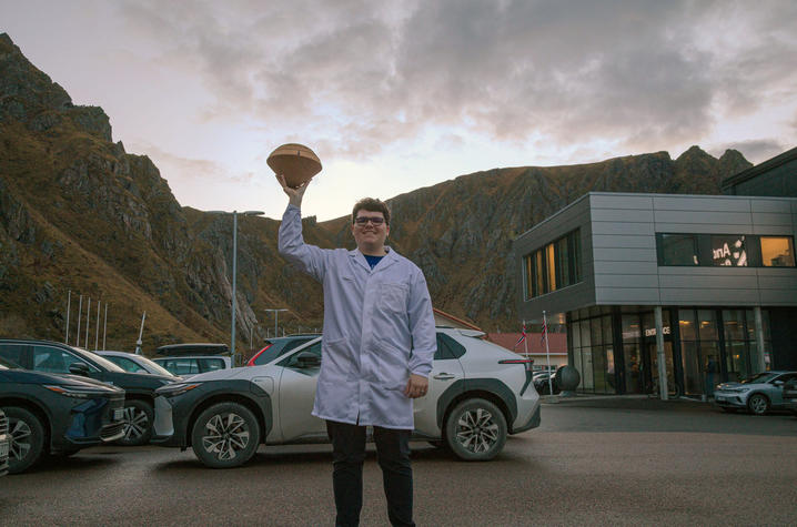 Eric Adams, a master’s student in mechanical and aerospace engineering, holds the team’s payload before its launch with NASA’s GHOST mission in Norway. 
